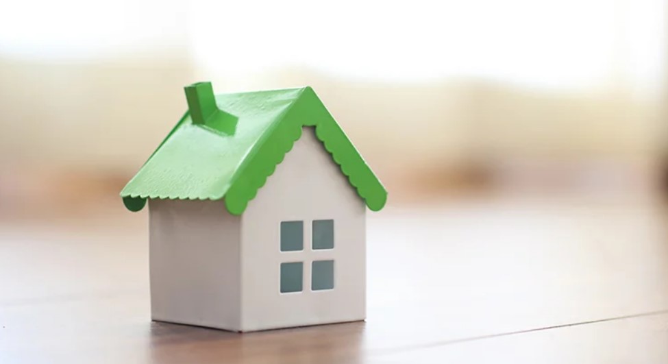 house figure with green roof